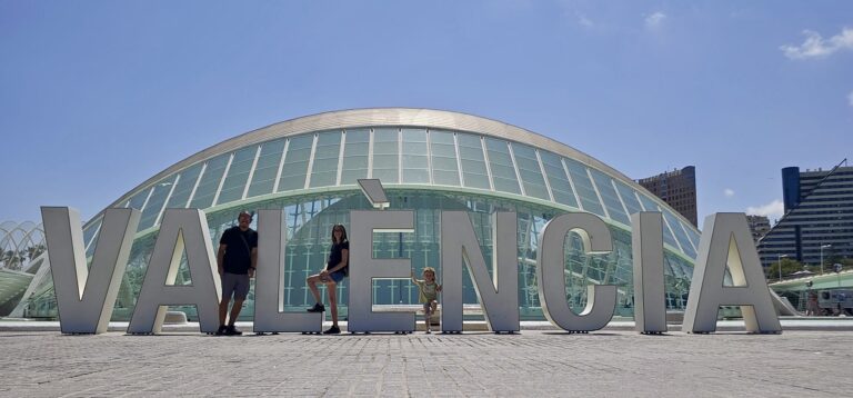 AtlasAdventured family picture in front of Valencia sign