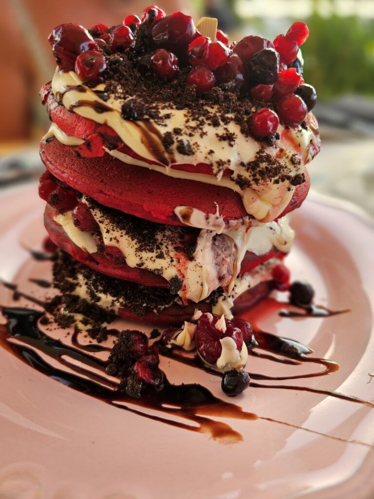 Red velvet pancakes with cream cheese frosting at Woodstock restaurant in Chania, Crete