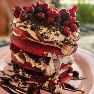 Red velvet pancakes with cream cheese frosting at Woodstock restaurant in Chania, Crete