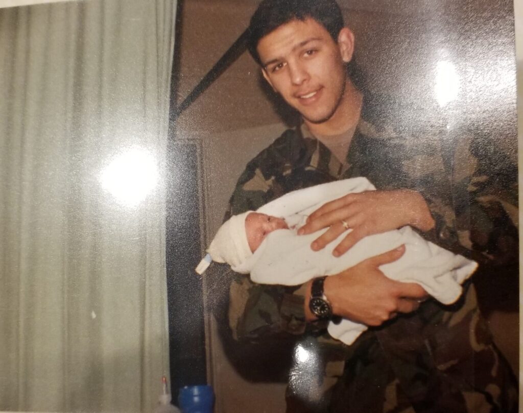 Army Ranger John Lawyer holding baby Seth from Atlas Adventured