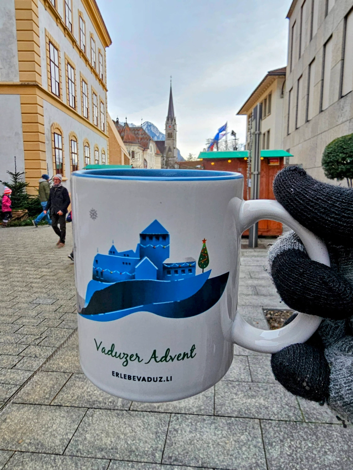 Enjoying some warm drinks while walking through Liechtenstein Christmas Market