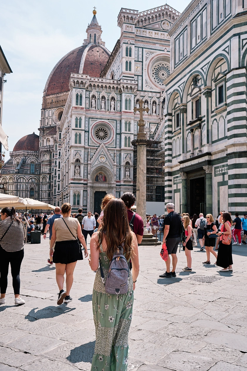 Walking by the duomo of Cathedral of Santa Maria del Fiore in Firenze, Florence, Italy