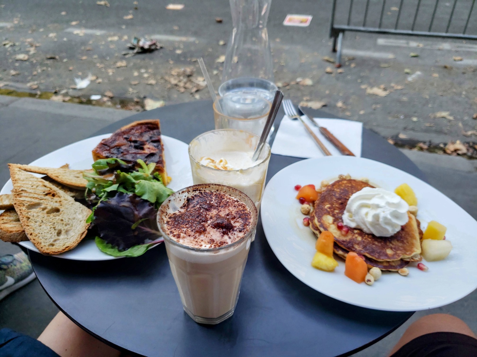 Enjoying a quiche, fruit pancakes, coffee and juice in Paris