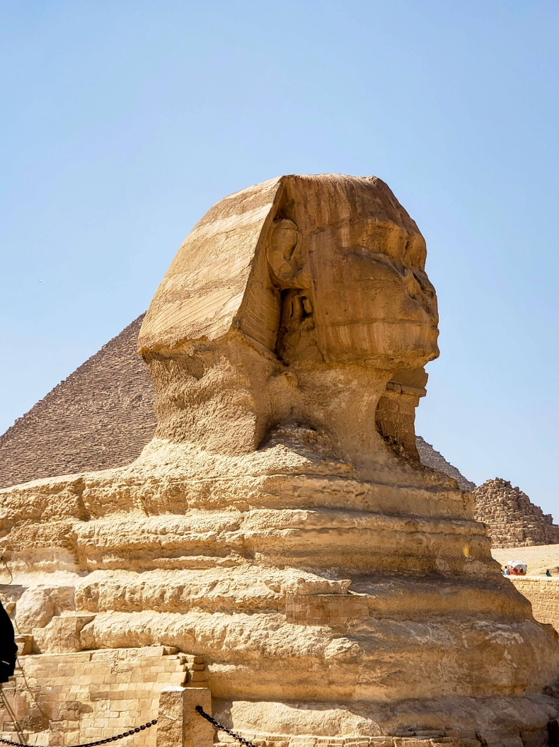 View of Great Sphinx of Giza in Egypt with pyramids in background