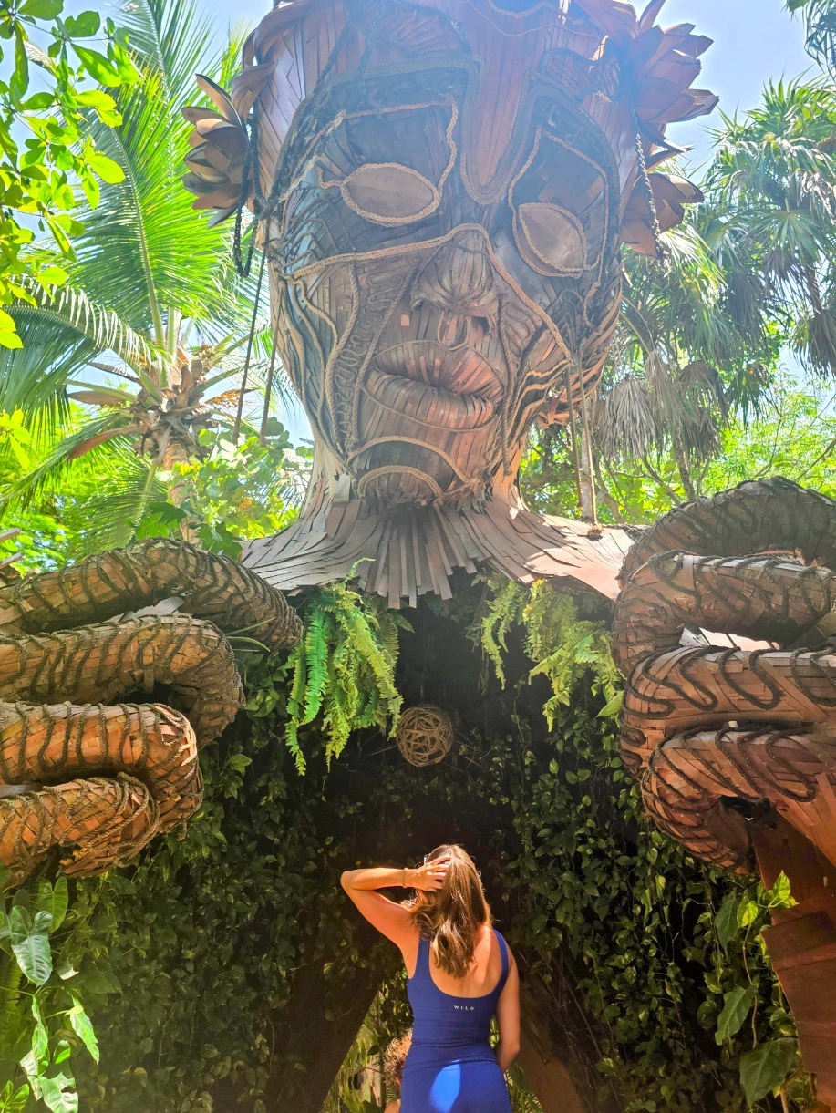 Standing at Escultura Ven a la Luz in Tulum, Mexico - TG