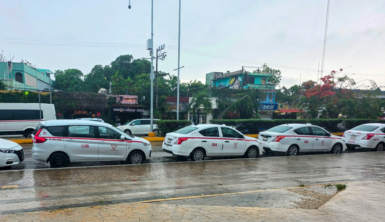 Taxis waiting outside Ado Bus Terminal in Tulum Mexico - TG
