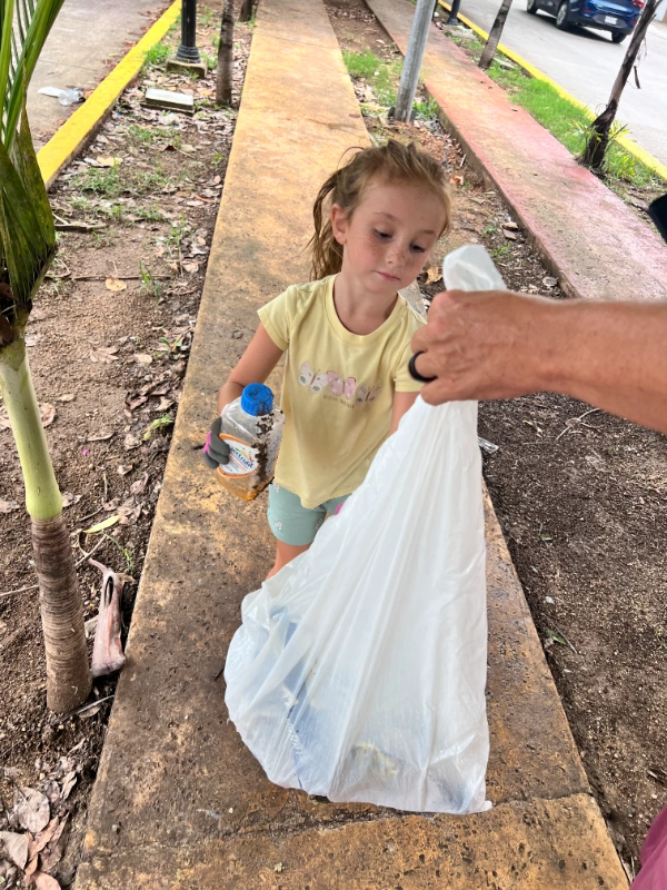 Picking up trash in Playa del Carmen, Mexico. Sustainable travel
